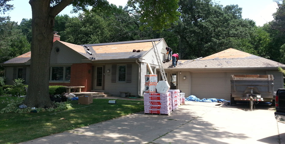Welter Construction Workings Installing shingles onto residential roof
