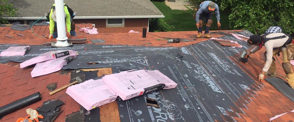workers installing a new roof in MN