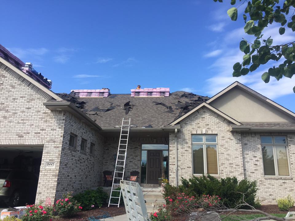 roof being re-shingled in MN