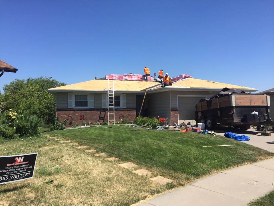 Welter Construction workings installing new roof on home in MN
