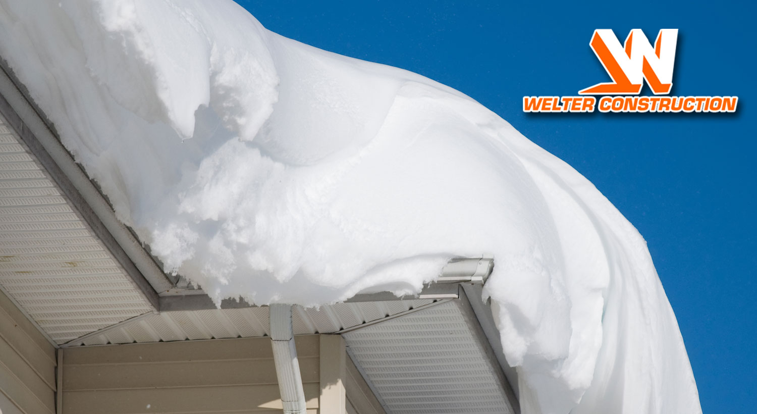photo of snow on eaves of roof